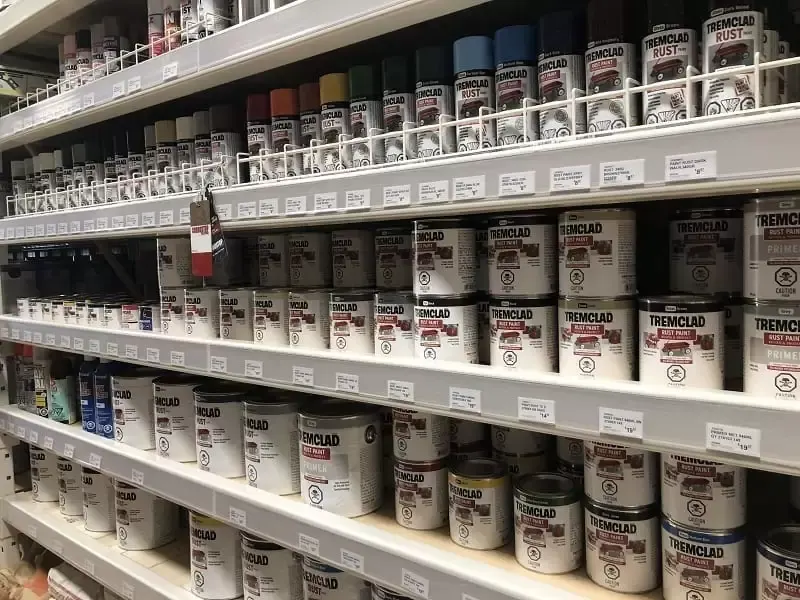 Shelves at a Great Lakes Rona hardware store stocked with Tremclad rust paint cans and aerosol spray primers.