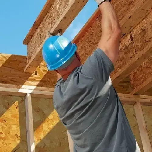 Man putting up trusses